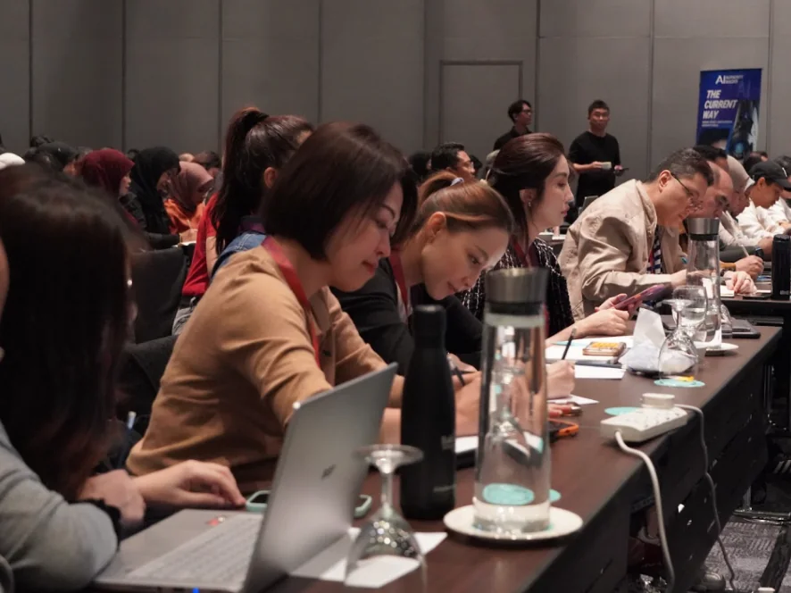 Attendees working on their laptops during the workshop