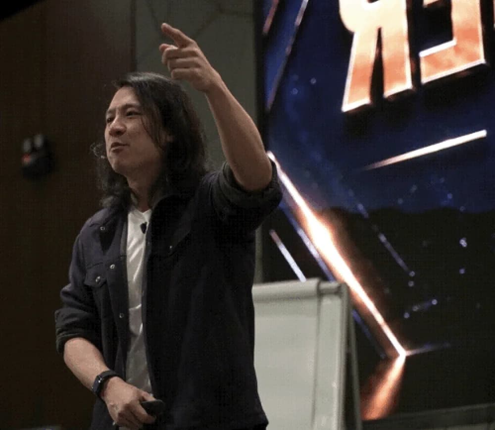 Thomas presenting on stage